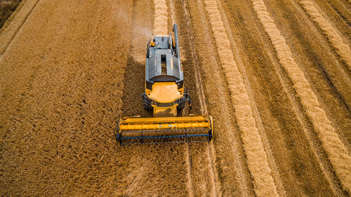 High angle view of combine harvester in field