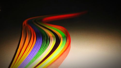 Close-up of rainbow over black background