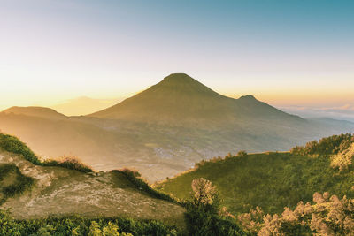 Scenic view of mountains against sky during sunset