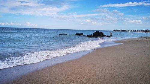 Scenic view of beach against sky