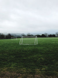 Scenic view of soccer field against sky