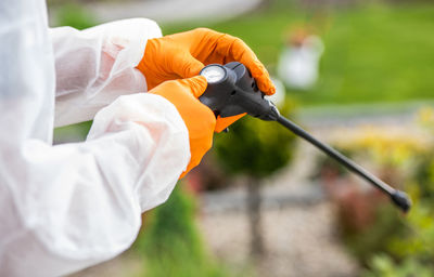 Cropped hand of person cleaning car