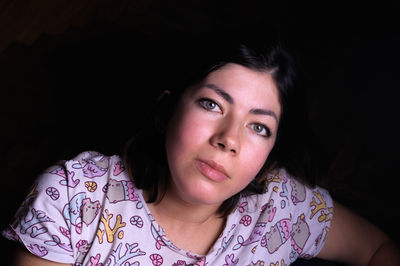 Portrait of woman in darkroom