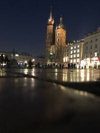 Illuminated buildings in city at night