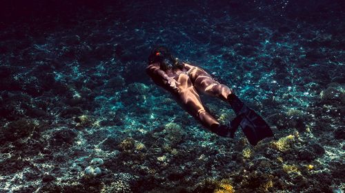 Woman swimming in sea