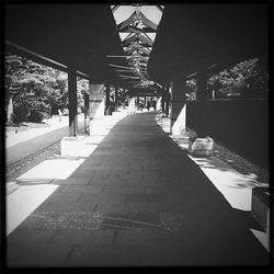 Empty road leading towards building