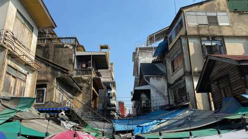 Low angle view of buildings against blue sky