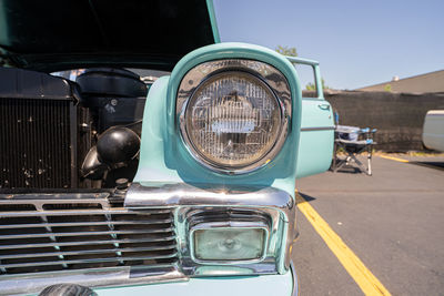 Close-up of vintage car on road