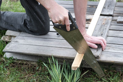 Man working on wooden plank