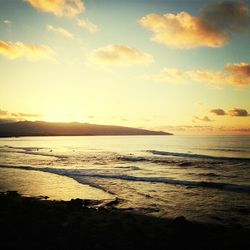 Scenic view of sea at sunset