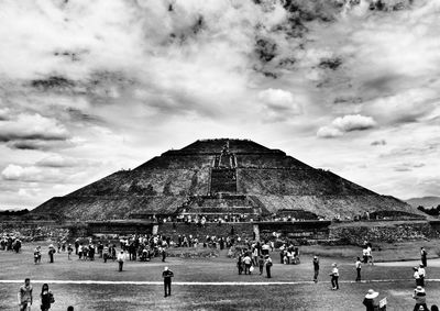 People at observation point against sky