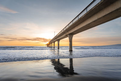 Beautiful sunrise over the new brighton pier at christchurch, new zealand.