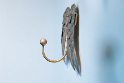 Low angle view of door handle against sky