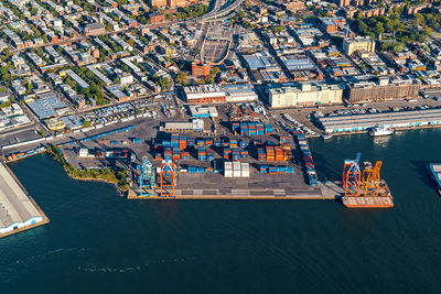 High angle view of commercial dock against buildings in city