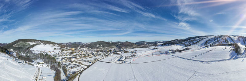 Flight over the ski resort and the town of willingen in hesse. the slopes are almost deserted.