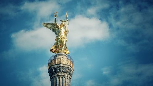 Low angle view of statue against sky
