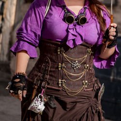Midsection of woman in costume
