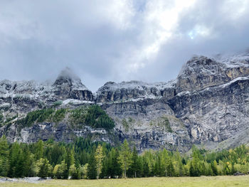 Panoramic view of trees and mountains against sky