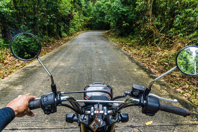 Man riding bicycle on road