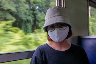 Portrait of young man wearing sunglasses outdoors