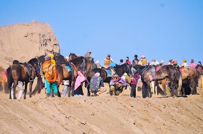 Panoramic view of people against clear sky