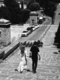 Rear view of people walking on water