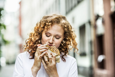 Portrait of woman eating food