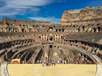 Group of people in front of historical building colosseum 