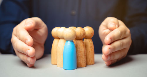 Midsection of man holding pills