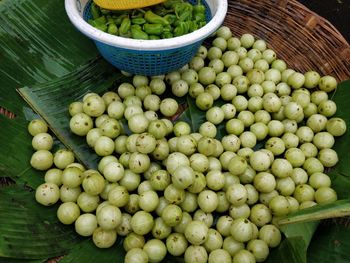 High angle view of gooseberrys for sale at market stall