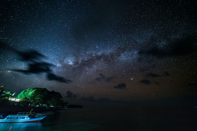 Scenic view of sea against sky at night