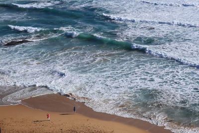 Aerial view of two people on beach