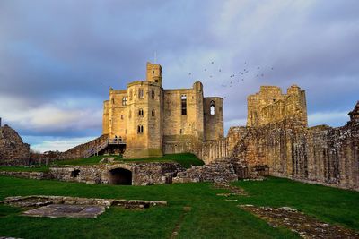 Old ruin building against cloudy sky