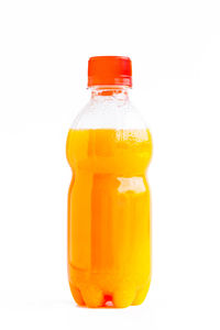 Close-up of orange juice against white background