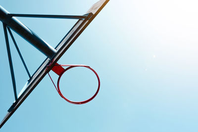 Low angle view of basketball hoop against clear sky