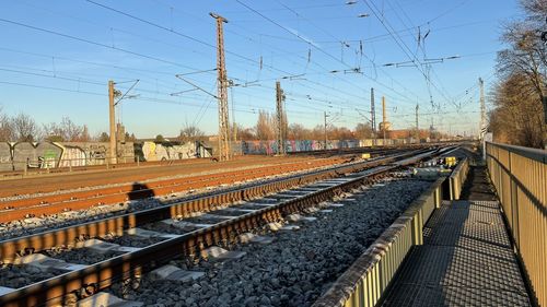 Train on railroad tracks against clear sky