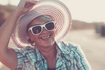 Portrait of smiling woman wearing hat