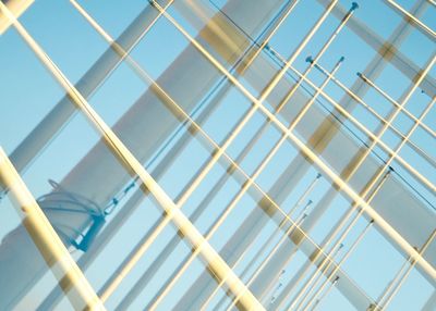 Low angle view of glass building against sky