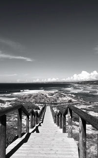 Pier over sea against sky