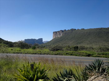 Scenic view of mountain range against clear blue sky