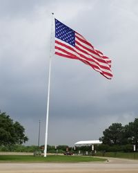 Low angle view of flag against sky