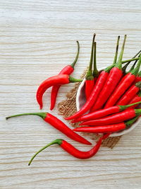 Close-up of red chili peppers on table