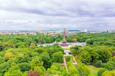 Panoramic view of trees and buildings against sky