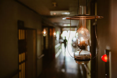 Close-up of oil lamp lighting up the hallways of a traditional ryokan in japan.