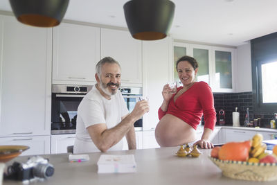 Portrait of a smiling young couple at home