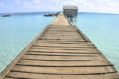 Pier over sea against sky