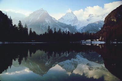 Scenic view of lake and mountains against sky