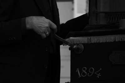 Close-up of hand holding camera