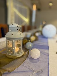 Close-up of illuminated lighting equipment on table