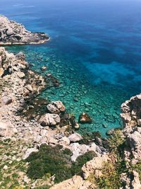 High angle view of rocks by sea